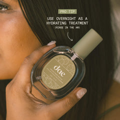 DAE bottle held in hand to show compact 1.7 oz travel-friendly size