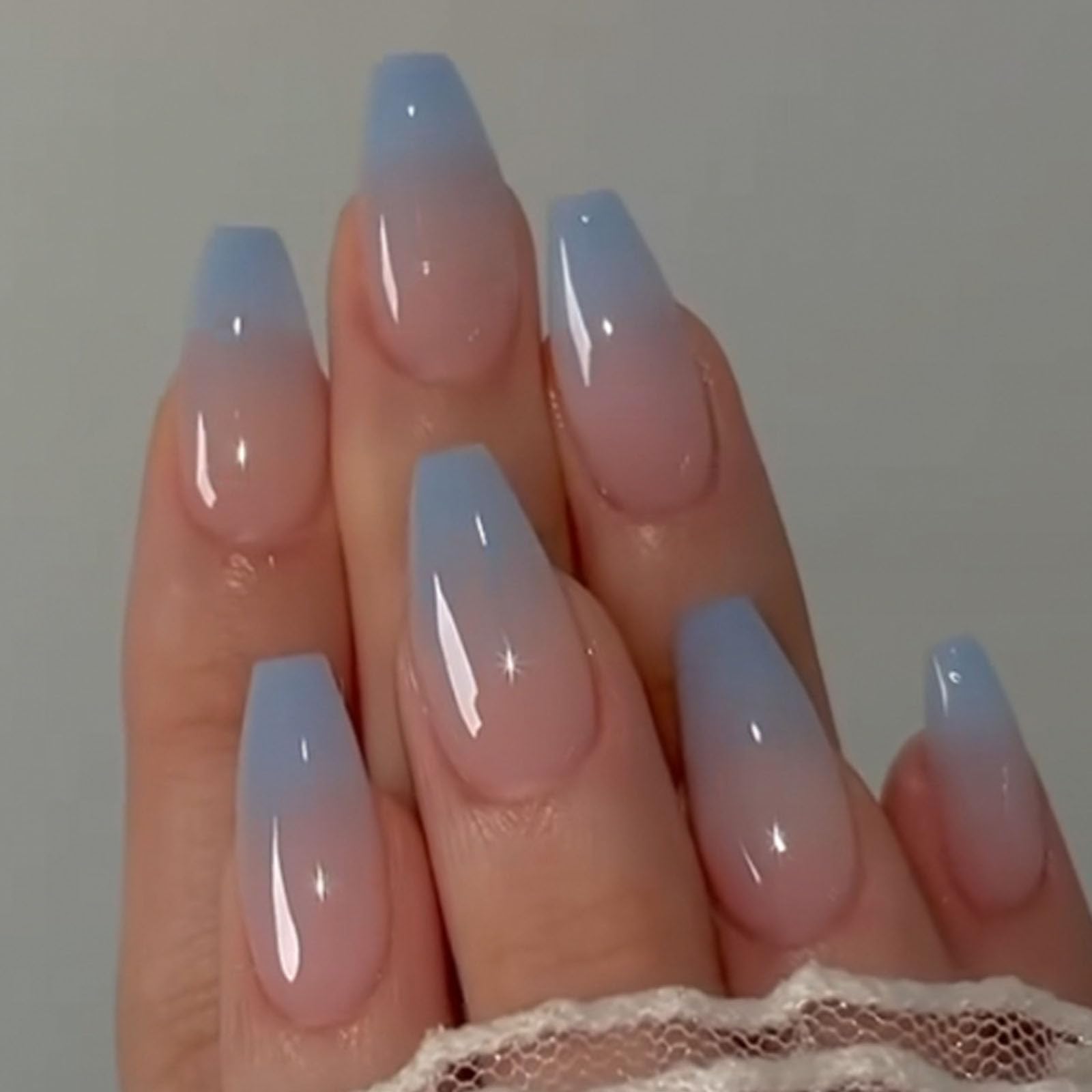 DANMANR blue shiny full-cover nails front packaging, shows set and glue for easy application