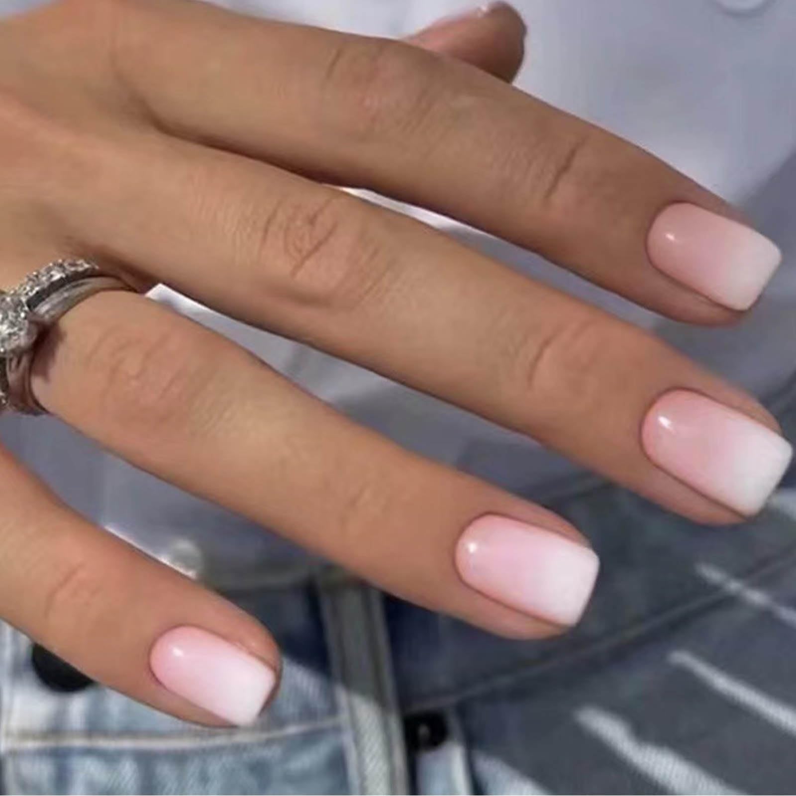 DANMANR front packaging showing 24 white pink press-on nails and included glue