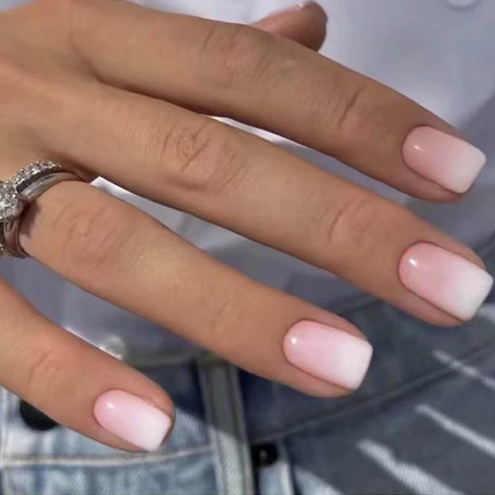 DANMANR front packaging showing 24 white pink press-on nails and included glue