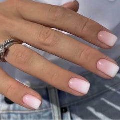 DANMANR front packaging showing 24 white pink press-on nails and included glue