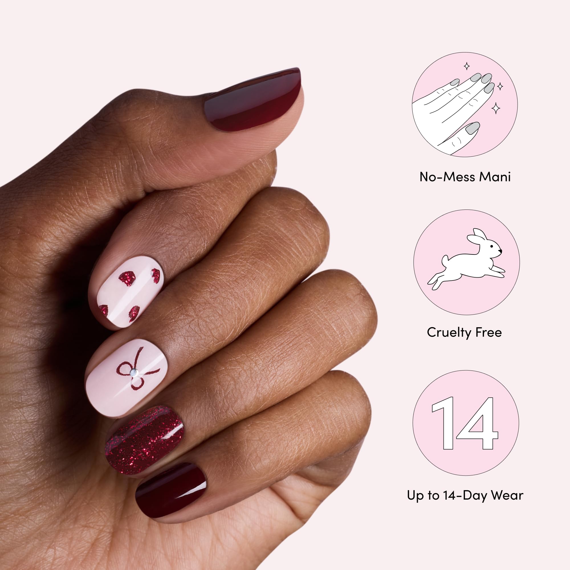 Dashing Diva on finished fingernails showcasing bow and heart accents
