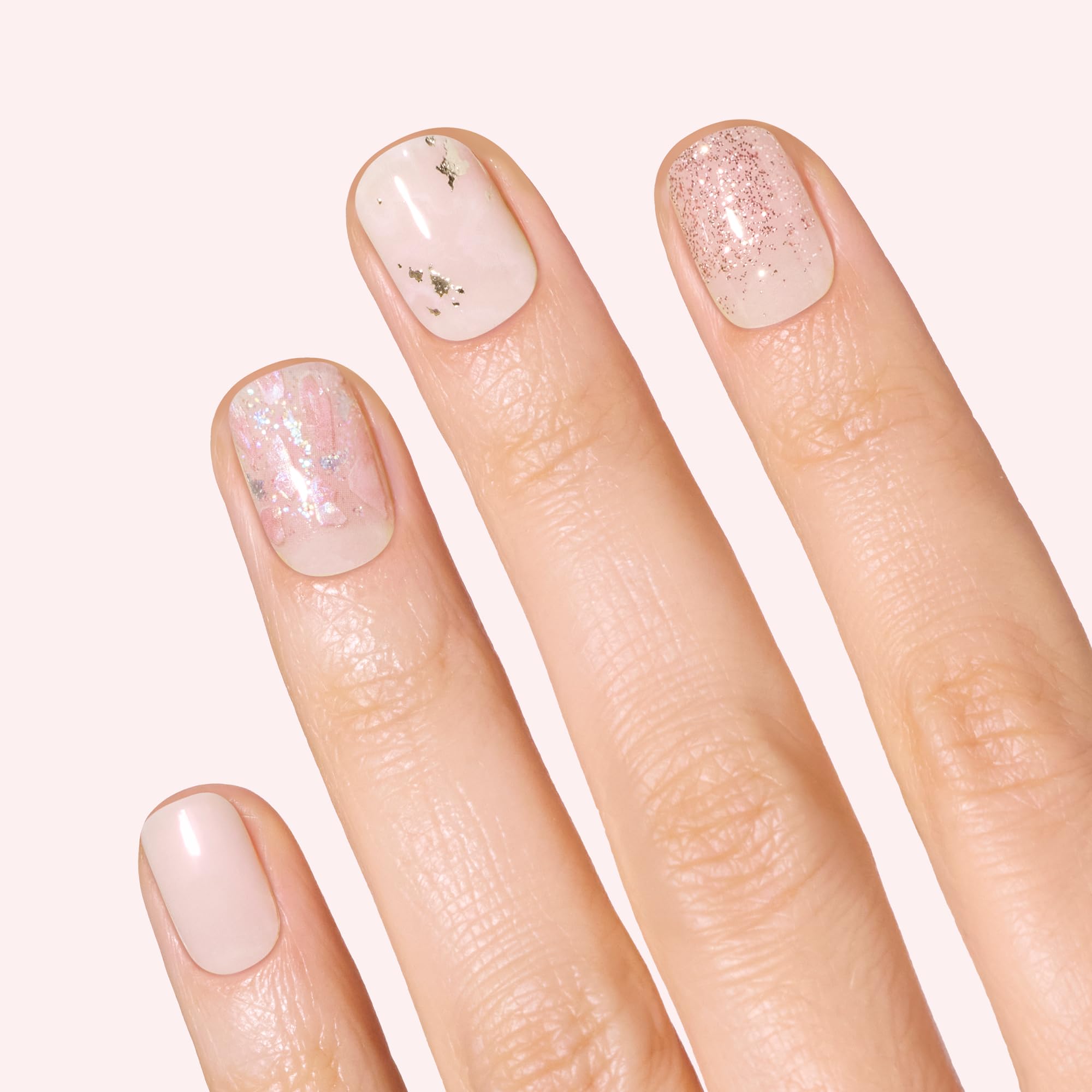 Dashing Diva close-up of marbling and rose gold glitter strips highlighting glossy detail