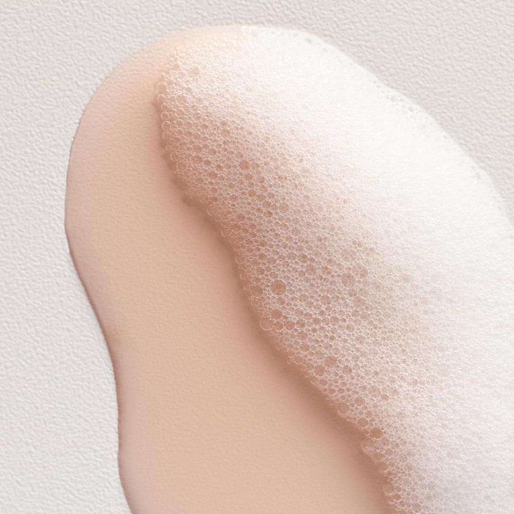 Davines bottle in hand size scale demonstrating 8.45 fl oz portability benefit