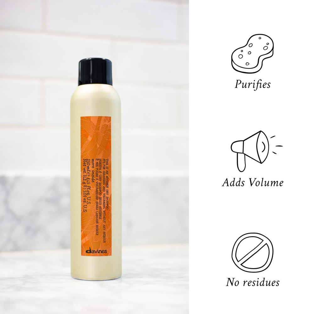 Davines bottle in hand for size comparison and travel-ready benefit
