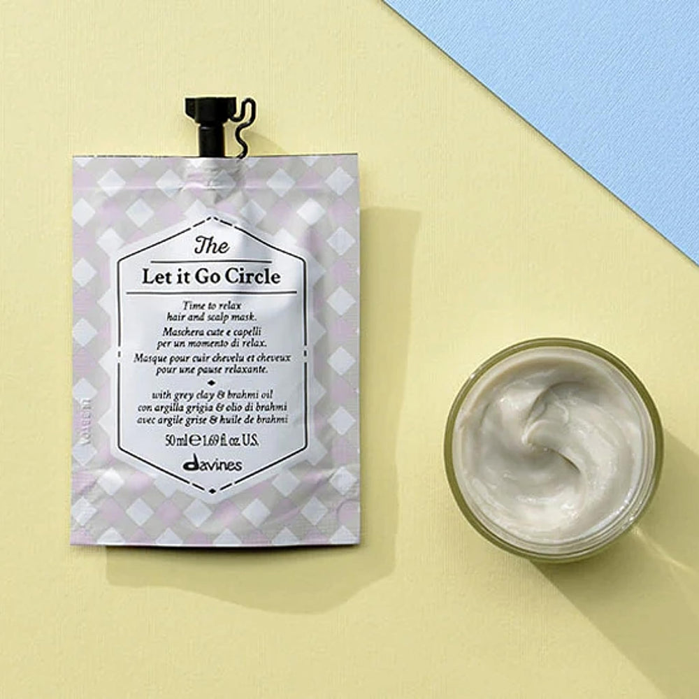 Davines applying mask to scalp demonstrating relaxing massage and targeted relief