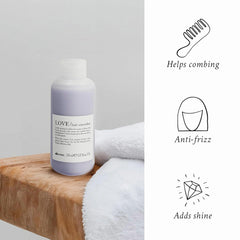 Davines LOVE being applied to damp hair to smooth frizz and improve manageability