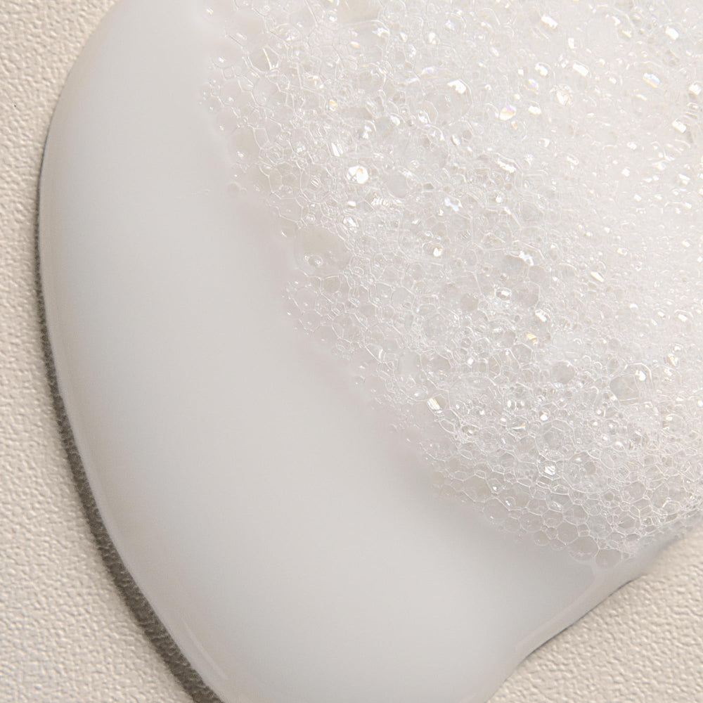 Davines rinsing co-wash from hair illustrating gentle cleanse and softness benefit