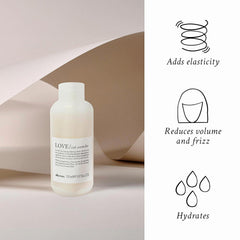 Davines cream texture on fingertip showing lightweight, non-greasy consistency