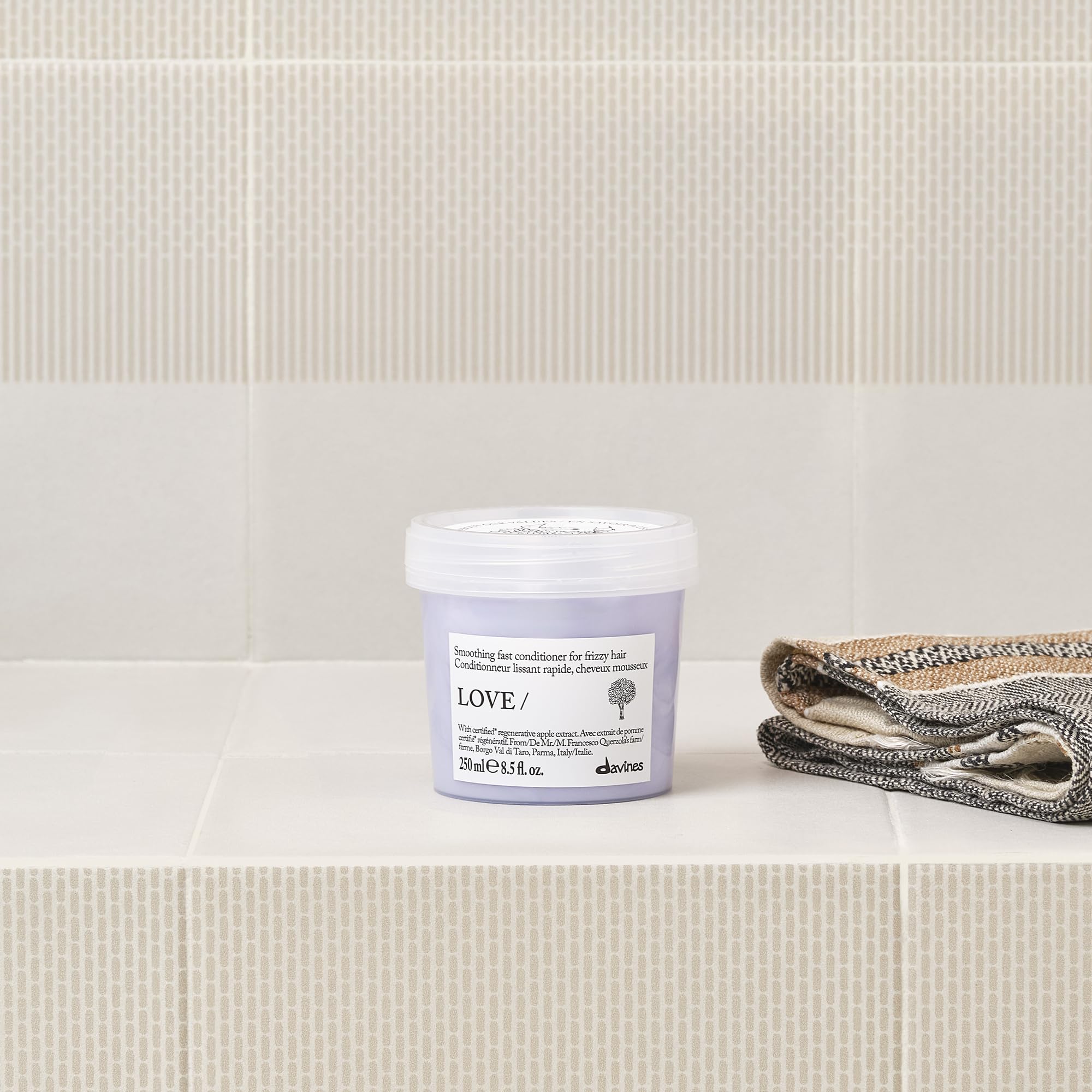 Davines LOVE SMOOTHING apple pulp extract close-up highlighting regenerative ingredient