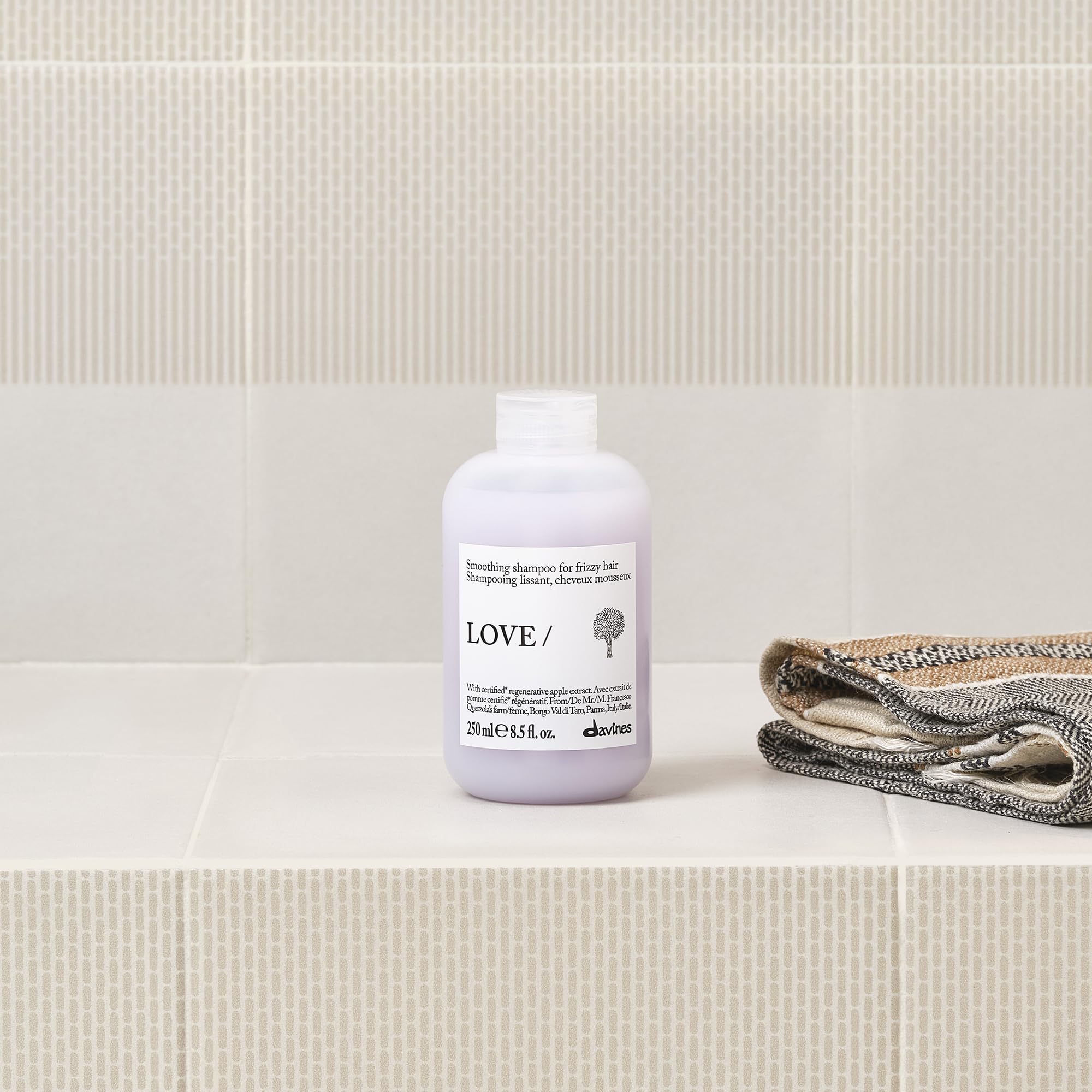 Davines apple pulp ingredient display emphasizing regenerative organic extract