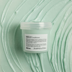 Davines MELU conditioner dispensing a small amount for controlled application