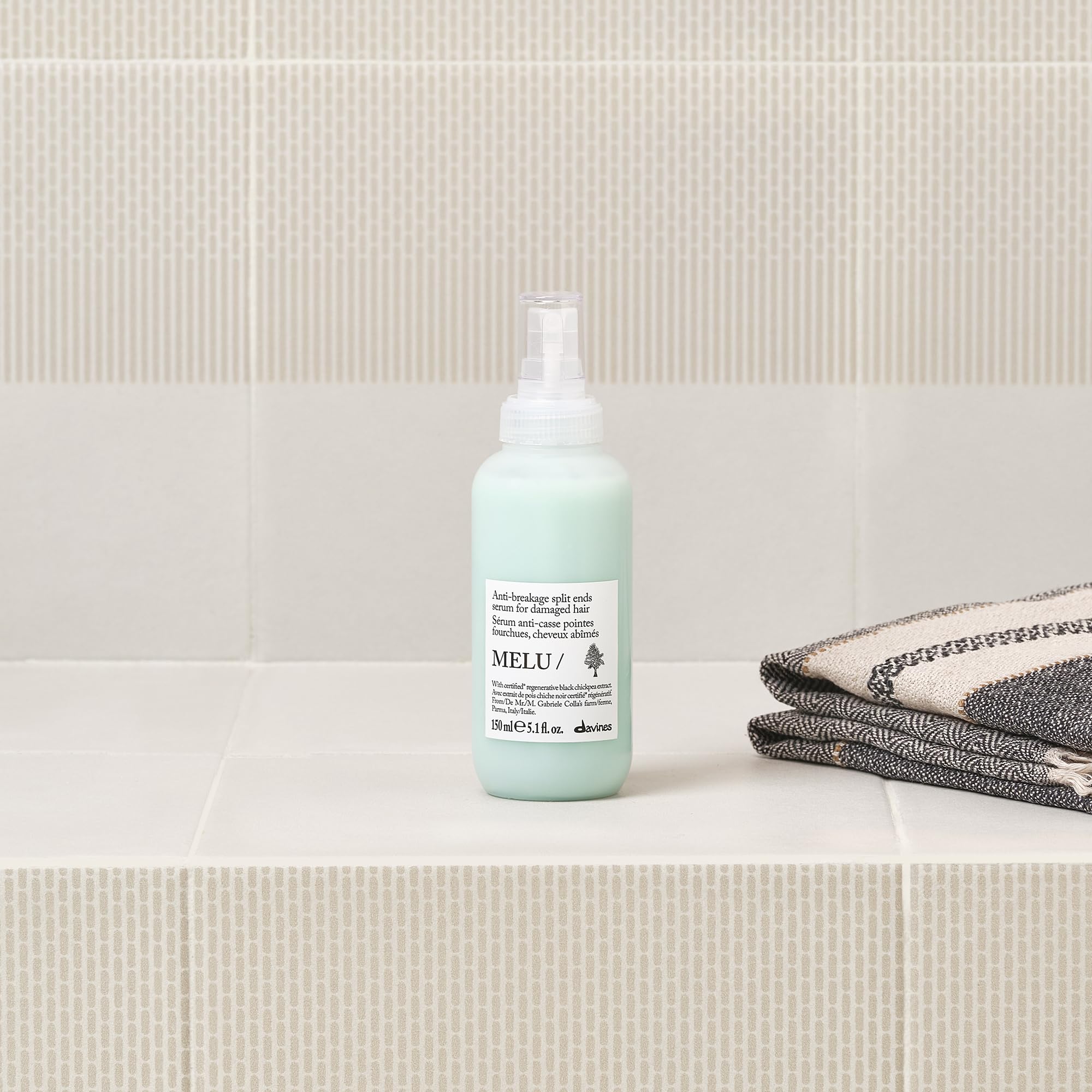 Davines MELU serum label and ingredients view emphasizing natural active components