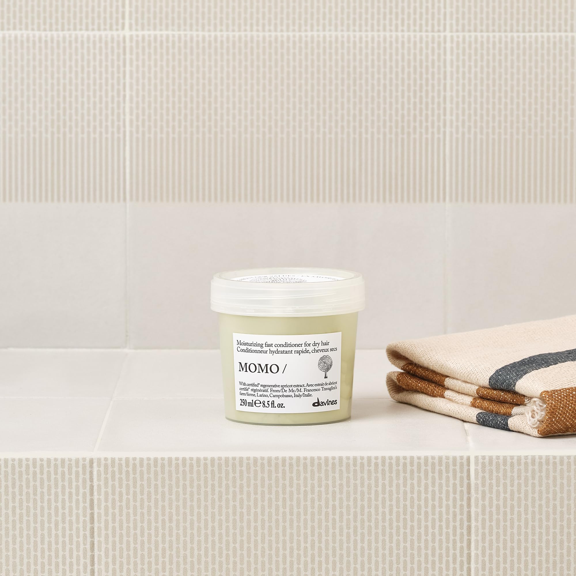 Davines MOMO conditioner cream texture demonstrating hydration and spreadability