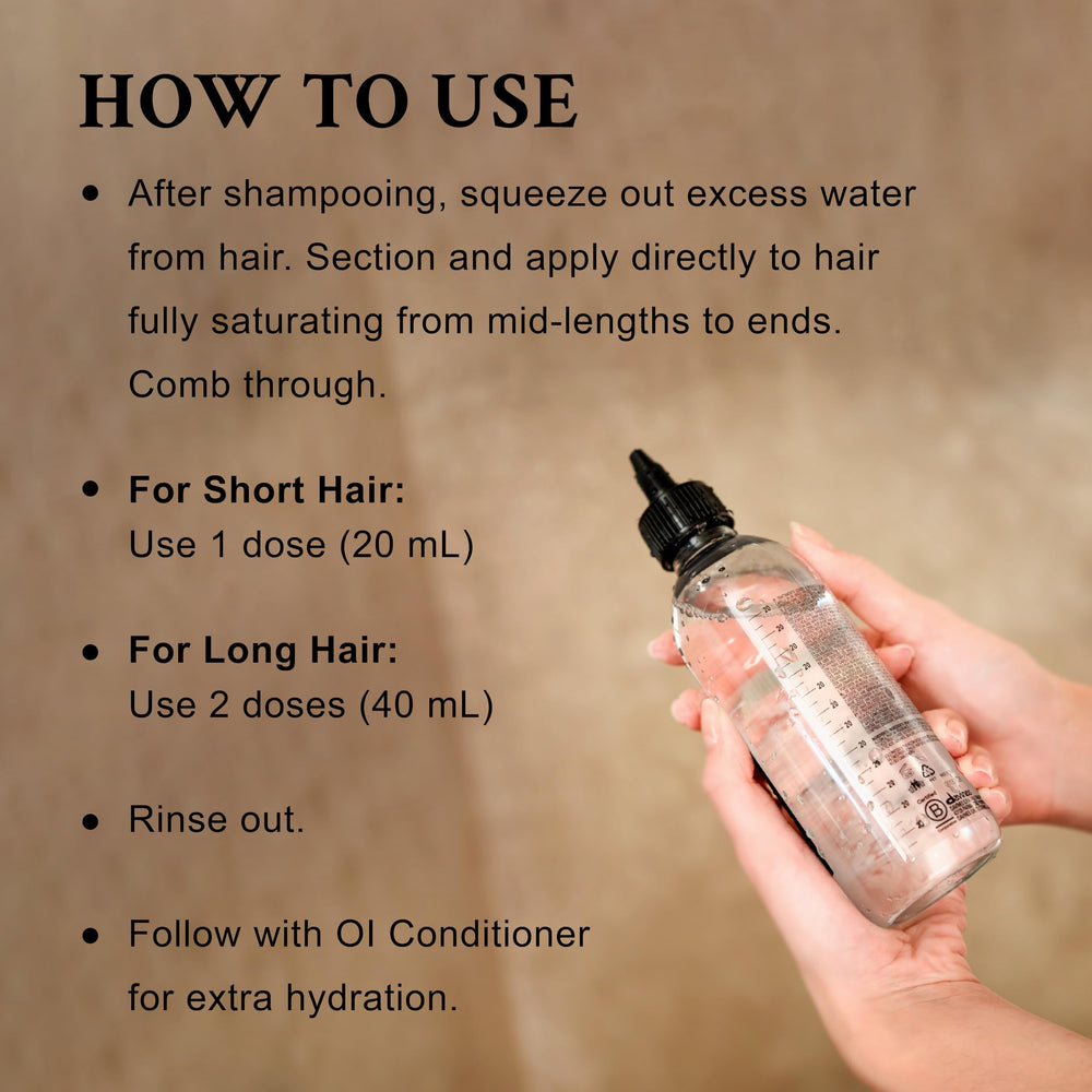 Davines OI Liquid Luster in hand for size comparison and easy dosing