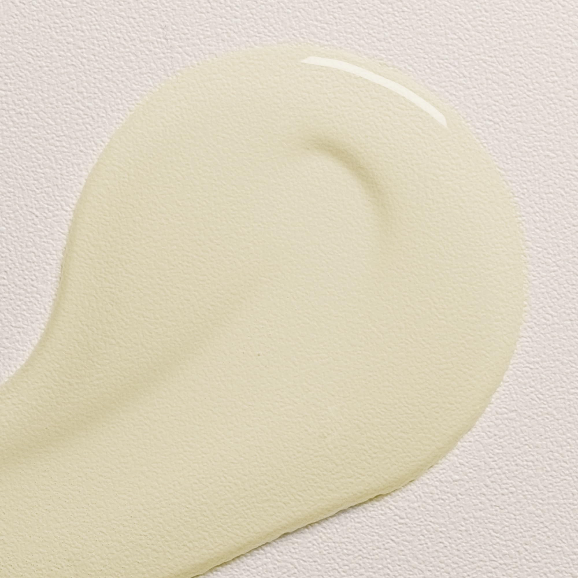 Davines OI Oil worked into damp hair for detangling and heat protection