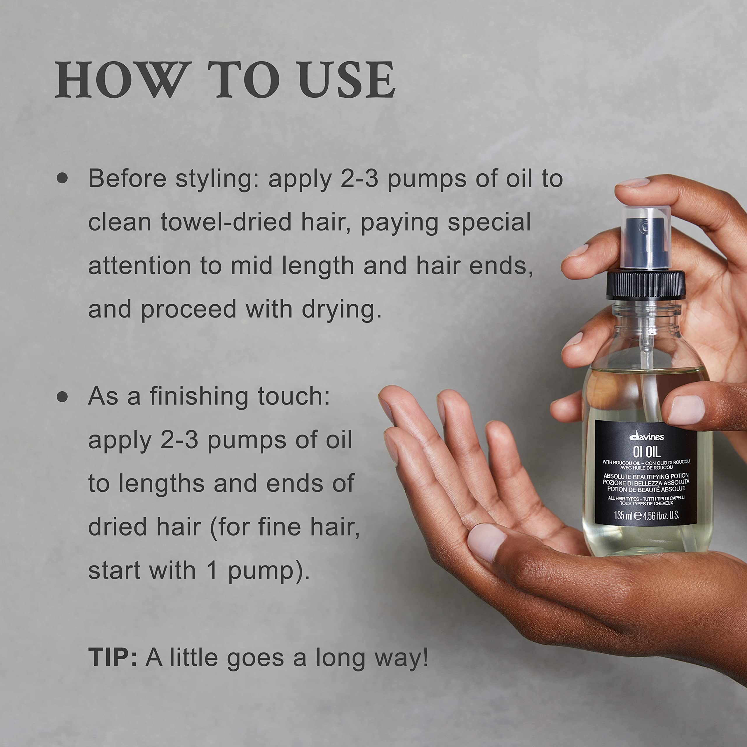 Davines OI Oil applied to dry hair providing instant frizz control