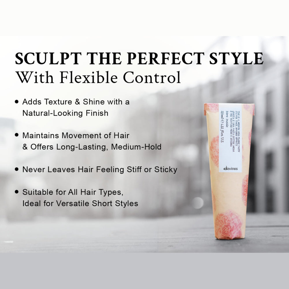Davines paste beside a ruler showing 4.23 fl oz scale for size and portability