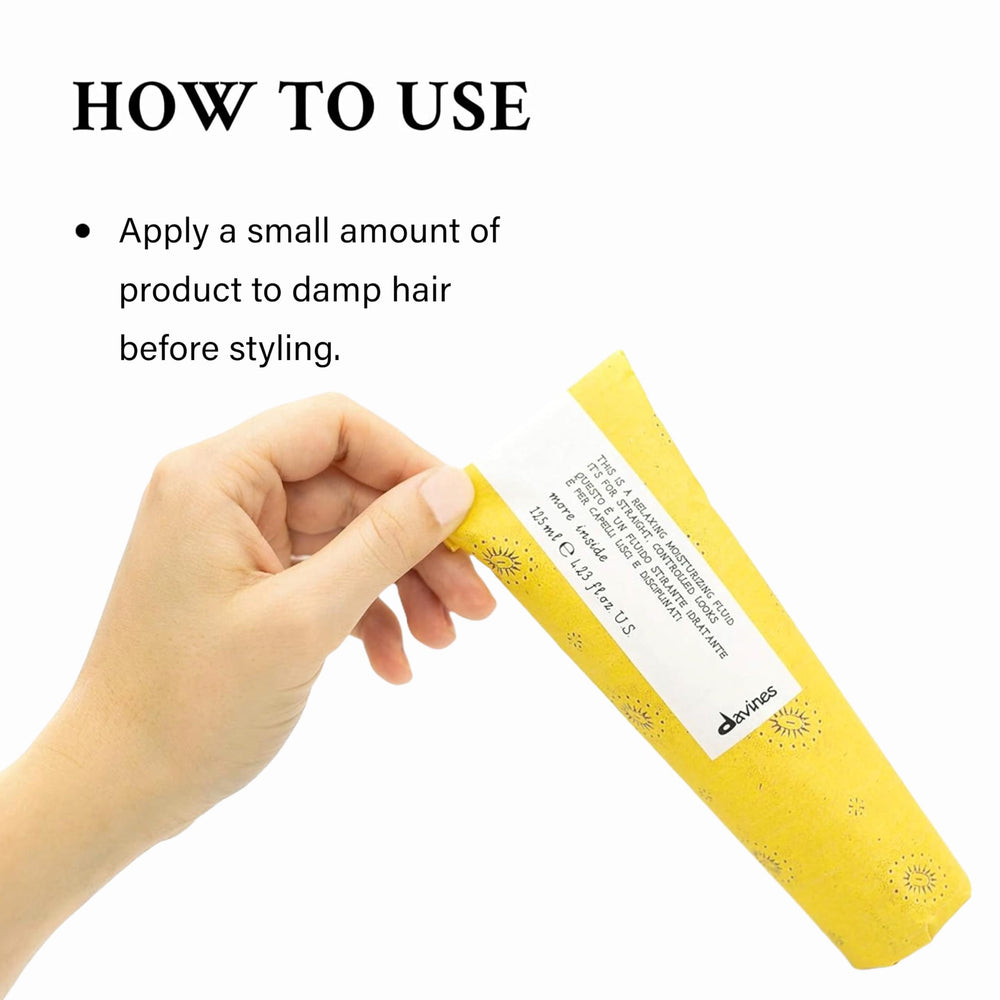 Applying Davines fluid to damp hair to prep for blow-drying and smoother styling