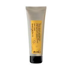 Davines bottle front view showing sleek design and moisturizing fluid benefit