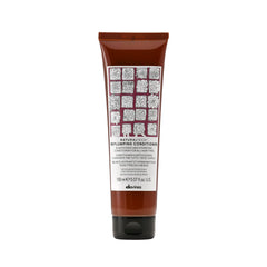 Davines replumping conditioner front packaging shows product and benefits