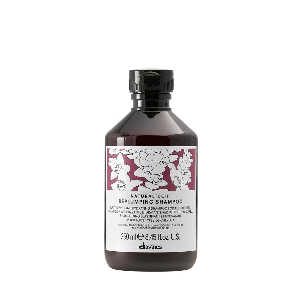 Davines replumping shampoo front bottle shows brand and styling benefit