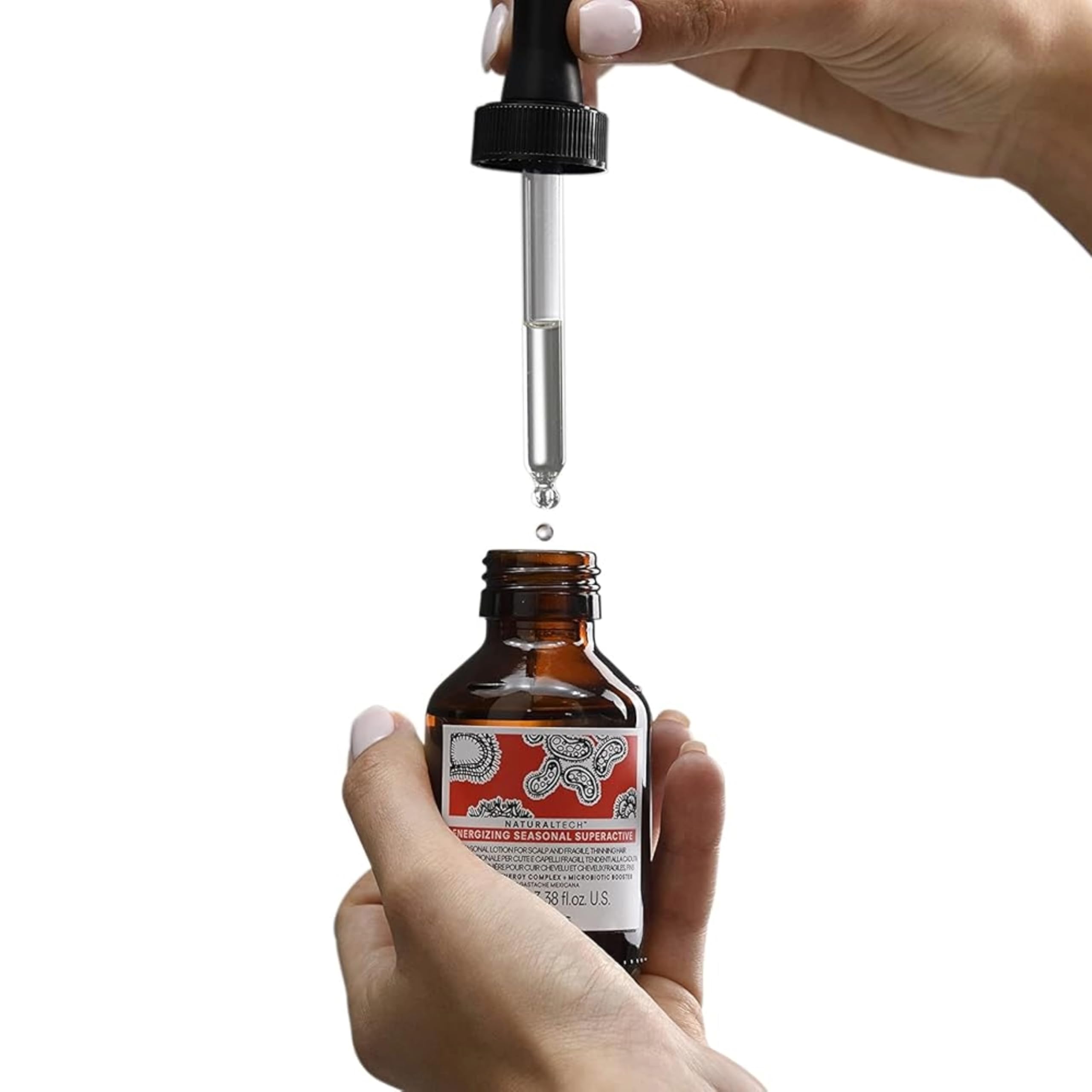 Davines travel-size bottle in hand demonstrating compact convenience