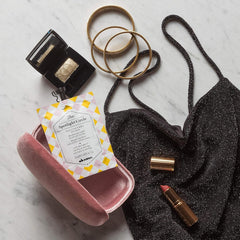 Davines mask size comparison next to hand demonstrating portable travel size