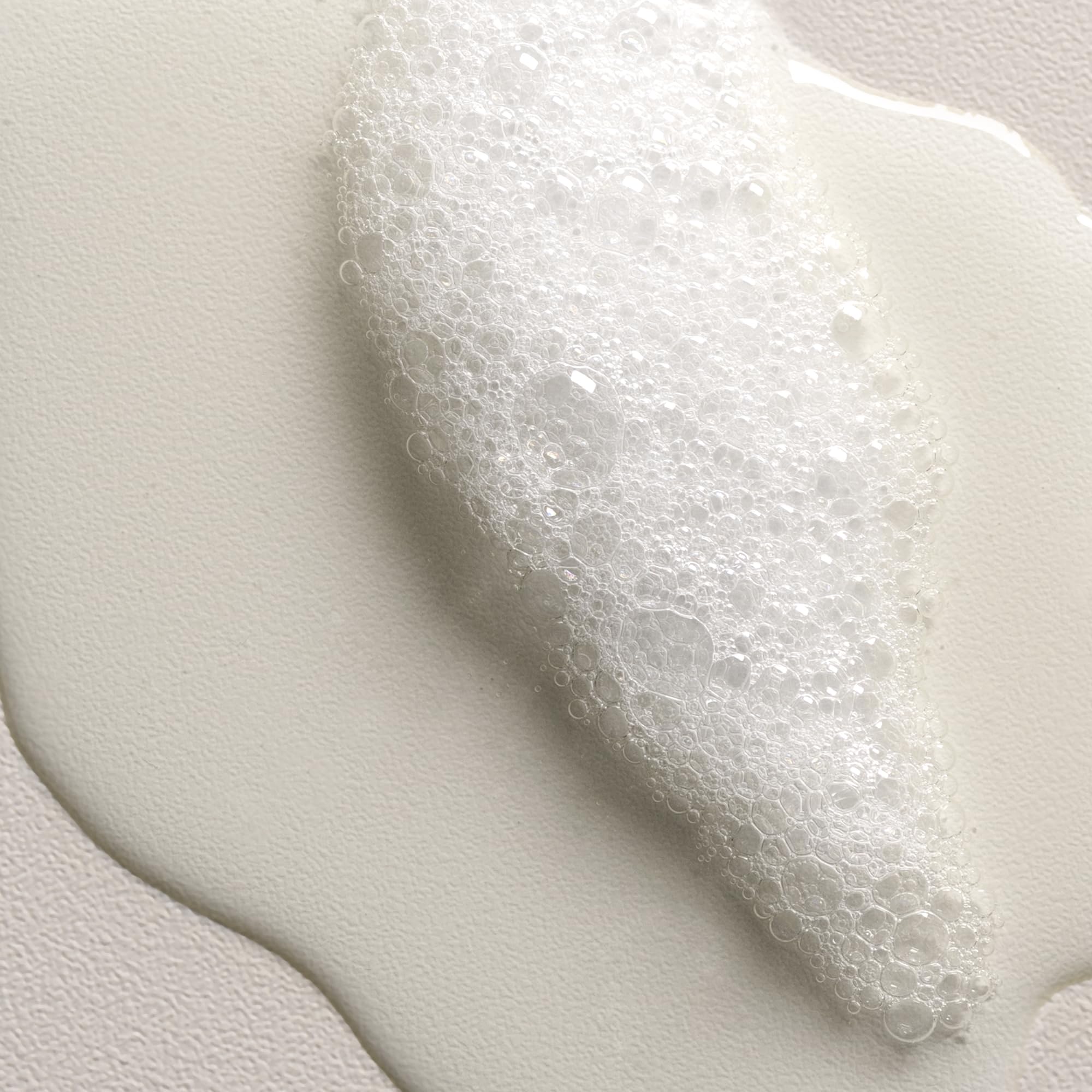 Davines VOLU shampoo being massaged into fine hair for lift