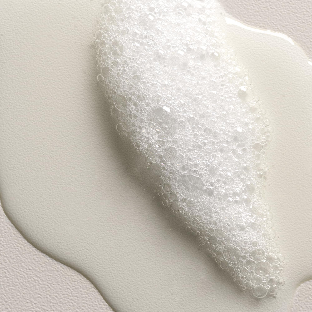 Davines VOLU shampoo being massaged into fine hair for lift