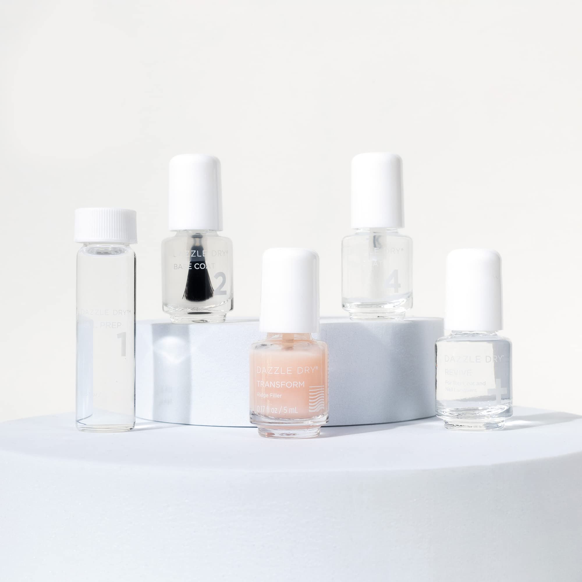 Dazzle Dry base and top coats side-by-side providing adhesion and high-gloss protection