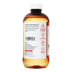 De La Cruz oil pouring from dropper showing easy measured application