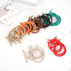 DealEachDay hair tie next to a hand to show 2-inch size and stretch
