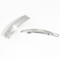 DED clip held in hand to show scale and size for long and medium hair compatibility