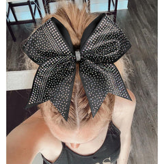 DEEKA bow next to ruler for size comparison showing statement-making 7.5–8 inch width