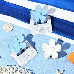 DEEKA clips attached to floral cards, showing ready-to-gift presentation