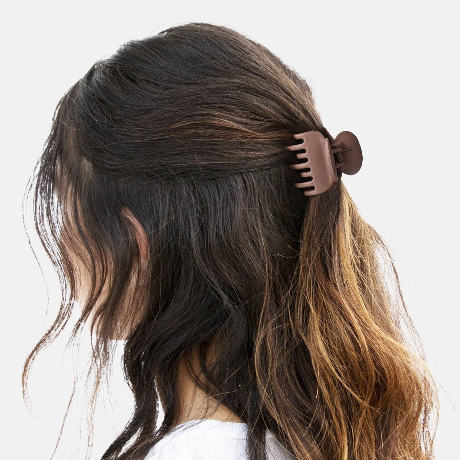 DEEKA clip securing half-up hairstyle illustrating effortless styling