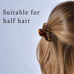 DEEKA in hair half-bun styling demonstrates secure hold and stylish finish
