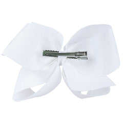 DEEKA bow beside a hand for scale showing true 4-inch size benefit for styling