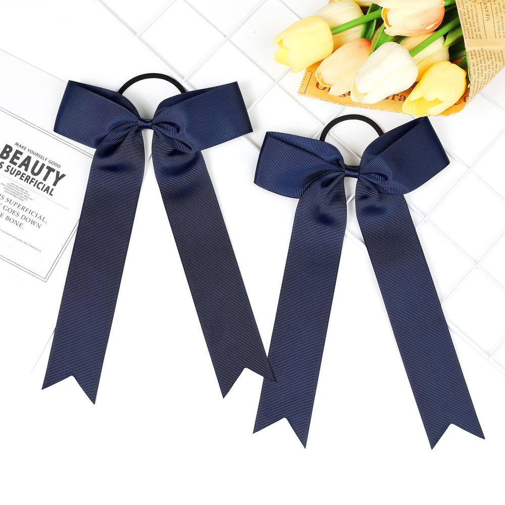 DEEKA bow beside a ruler showing exact 5.5 by 9 inch size for scale