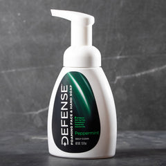 Defense Soap natural ingredient display with oils and aloe for soothing