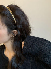 Deghew gold headband styled with outfit on model adding subtle metallic accent for special occasions