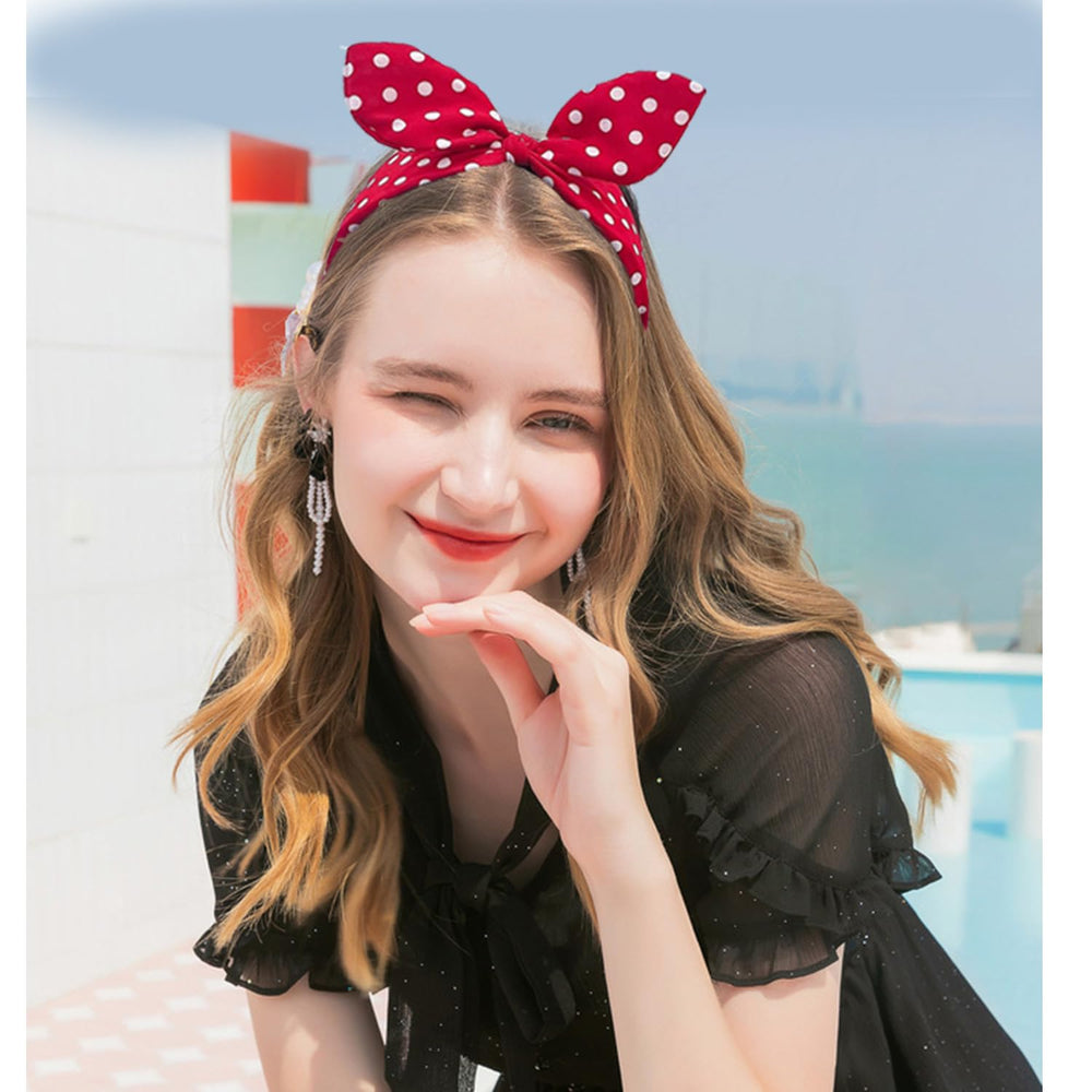 Deghew hand holding headband showing scale and lightweight design benefit