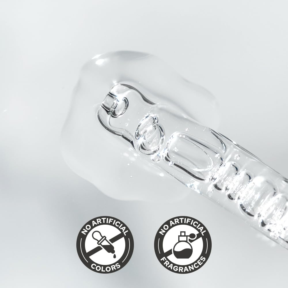 De:maf ampoule next to coin for size comparison showing travel-friendly volume