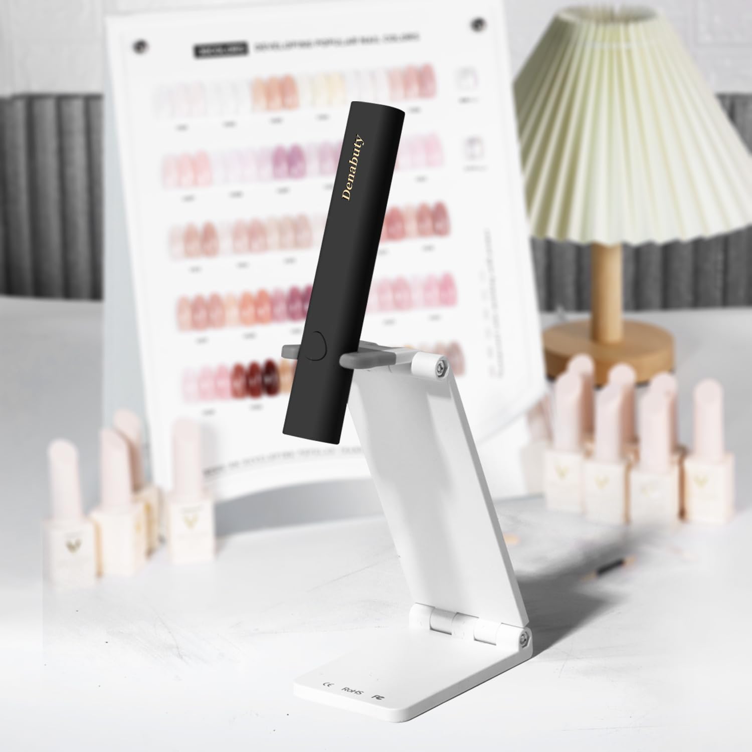 Denabuty curing nails with rhinestones to demonstrate precise nail-art support benefit