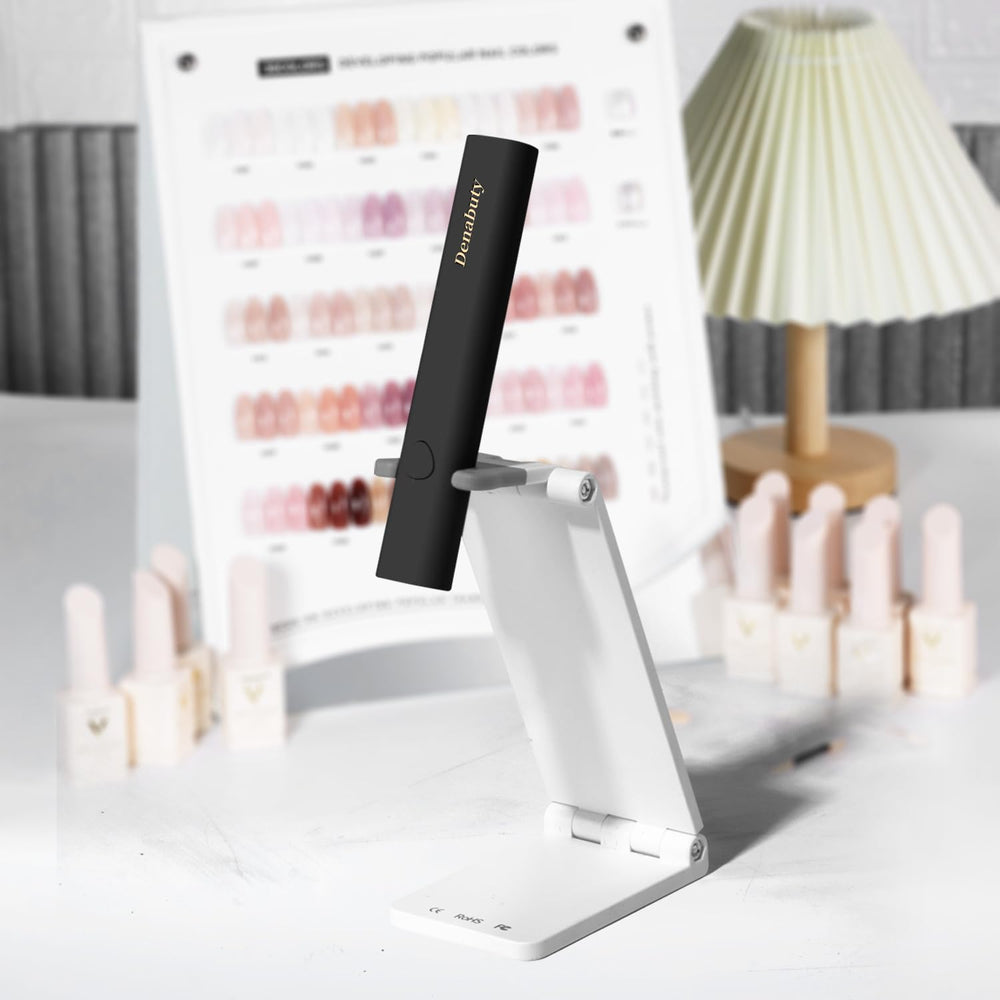 Denabuty curing nails with rhinestones to demonstrate precise nail-art support benefit