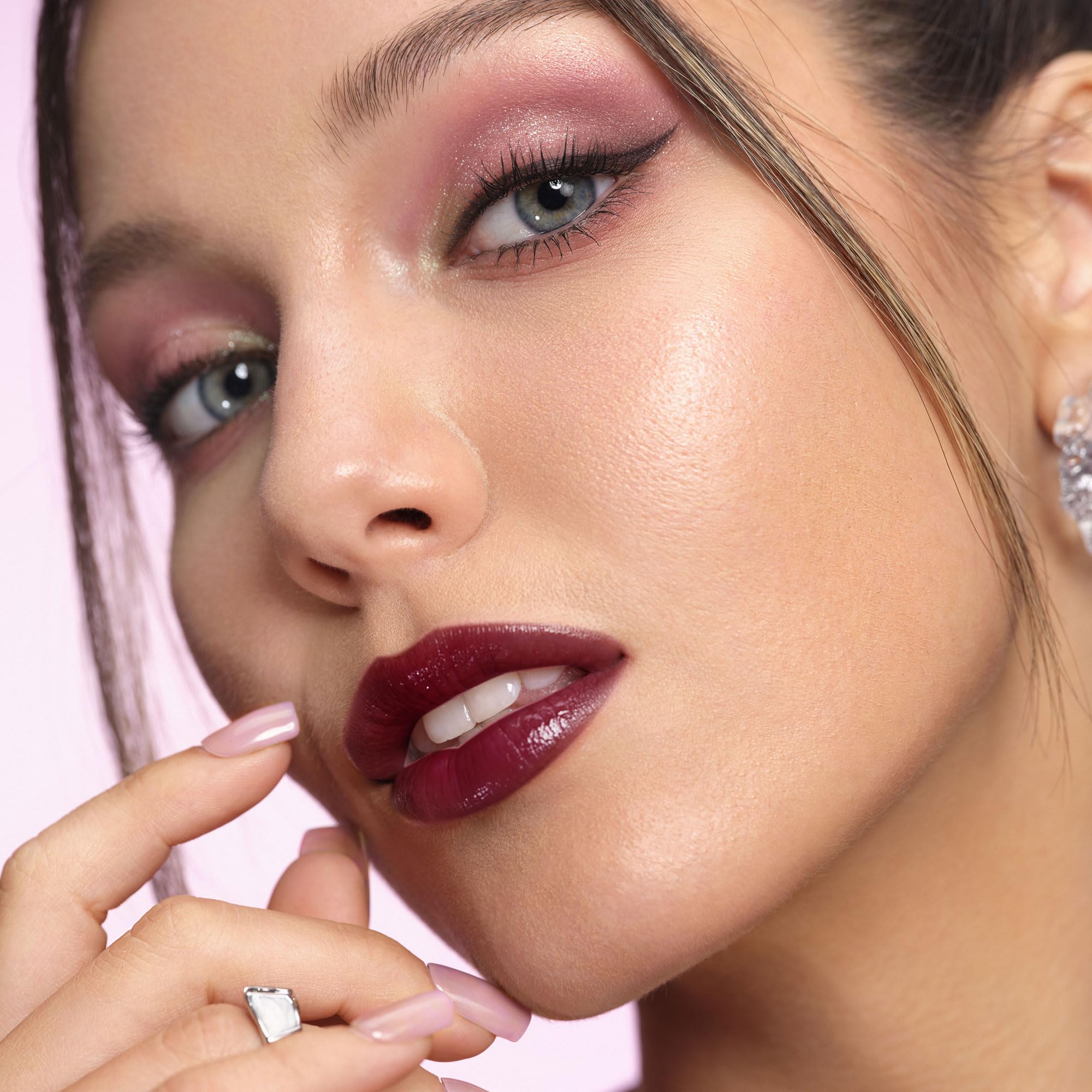 Depuplum applying on lips demonstrating smooth glide and buildable color