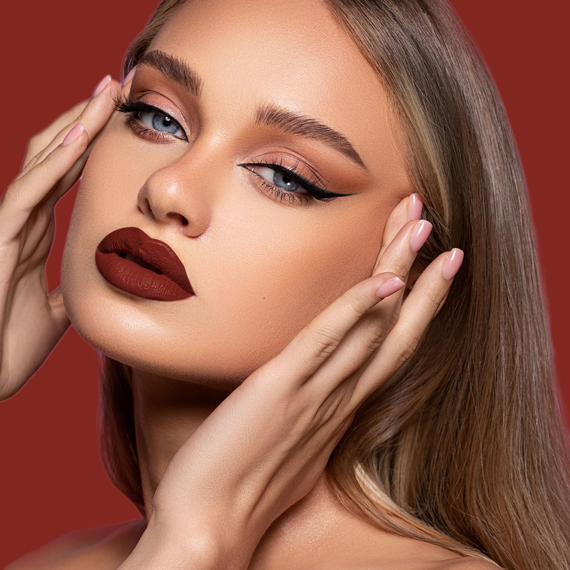 Depuplum swatched on lips showing smooth matte texture and full coverage