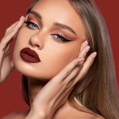 Depuplum swatched on lips showing smooth matte texture and full coverage