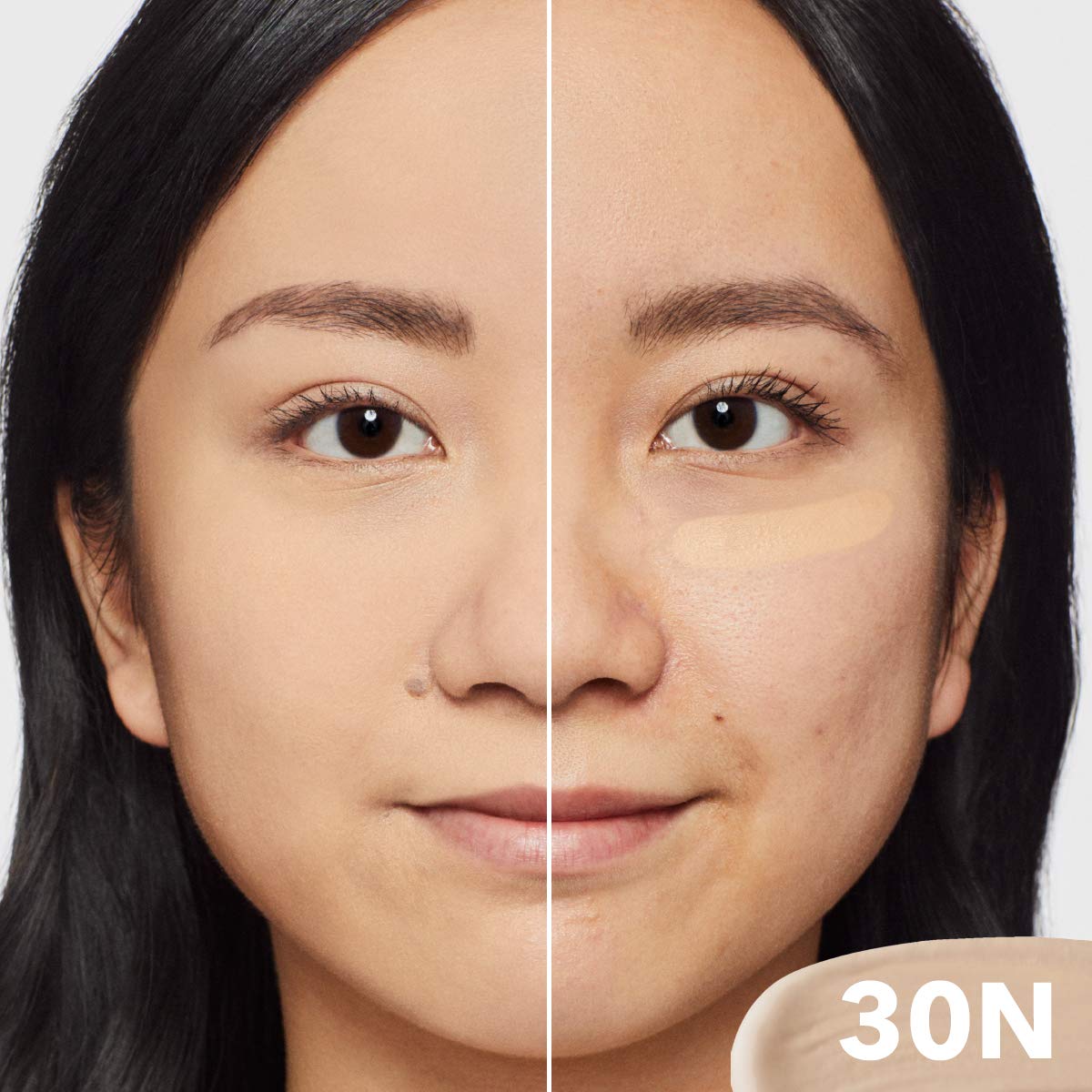 Dermablend concealer covering a blemish showing spot correction